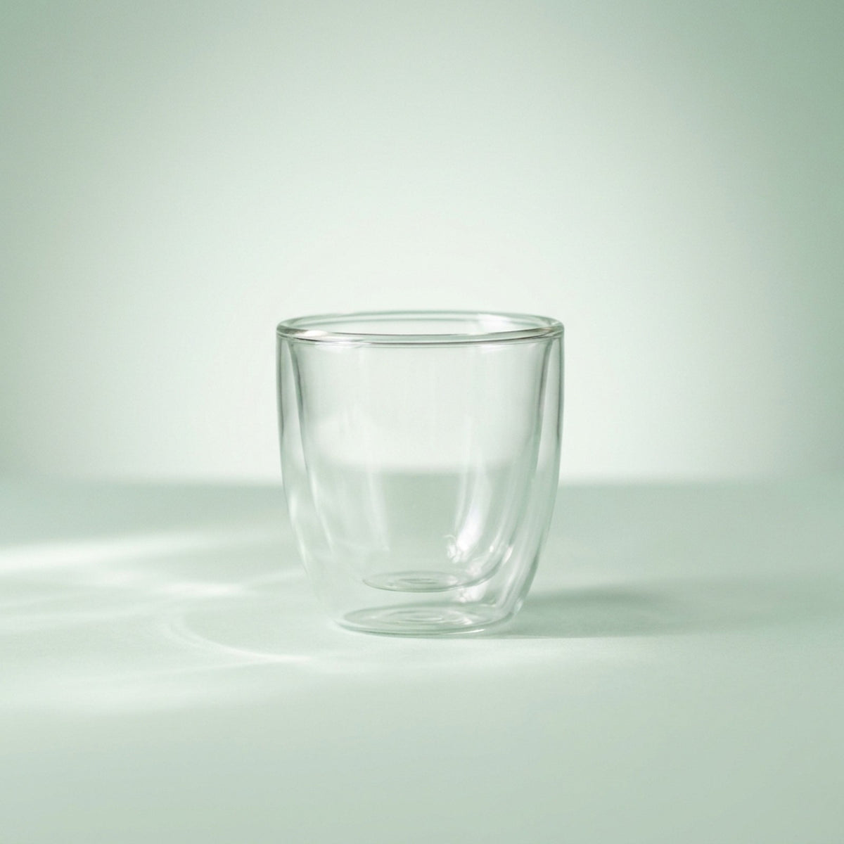 Empty double wall glass espresso cup showing the inner and outer walls
