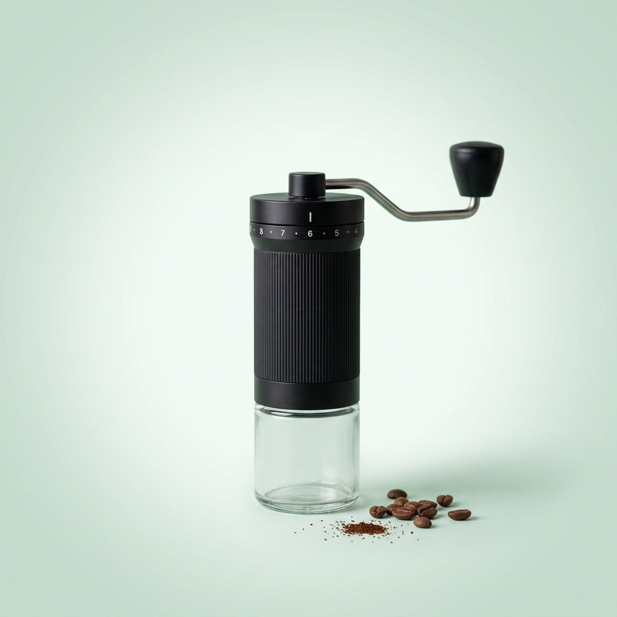 Manual coffee grinder with 40 grind settings and a glass grounds jar