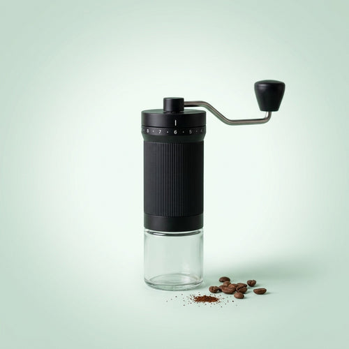 Manual coffee grinder with 40 grind settings and a glass grounds jar