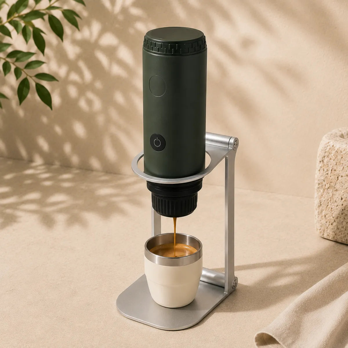 Forest green Origin in the Foldable Stand pouring an espresso into a cup on the base